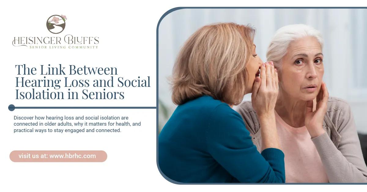 An elderly woman saying something to another elderly woman who's suffering from hearing loss