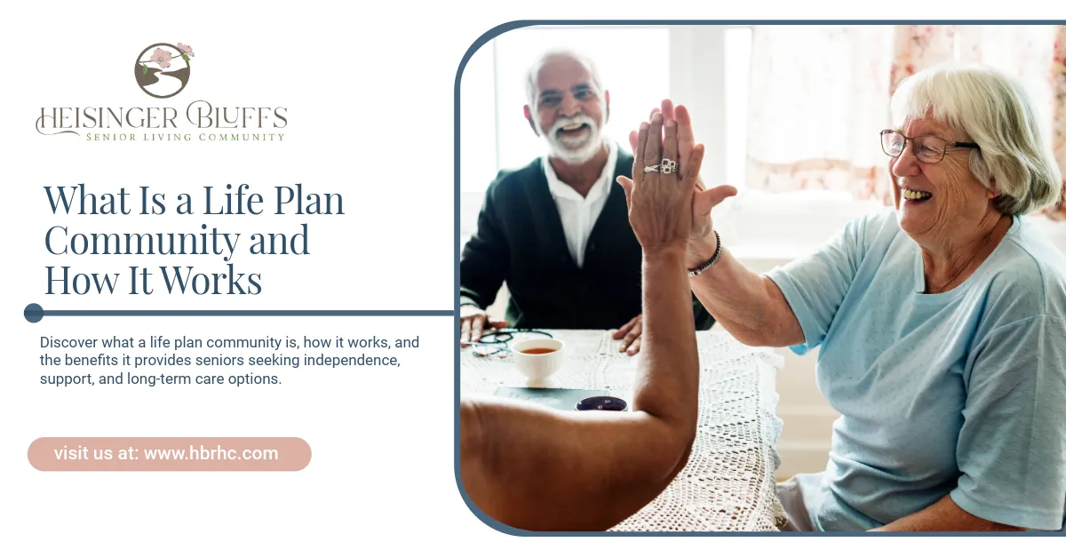 Smiling seniors high-fiving at a table in a life plan community.