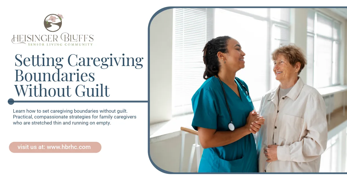 A caregiver laughing with an elderly woman in a hallway