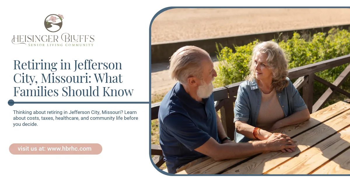 An elderly couple sitting together outdoors