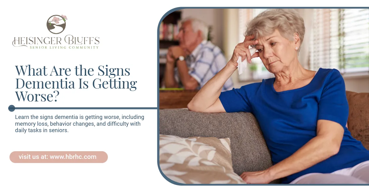 An old lady with dementia is sitting on a couch