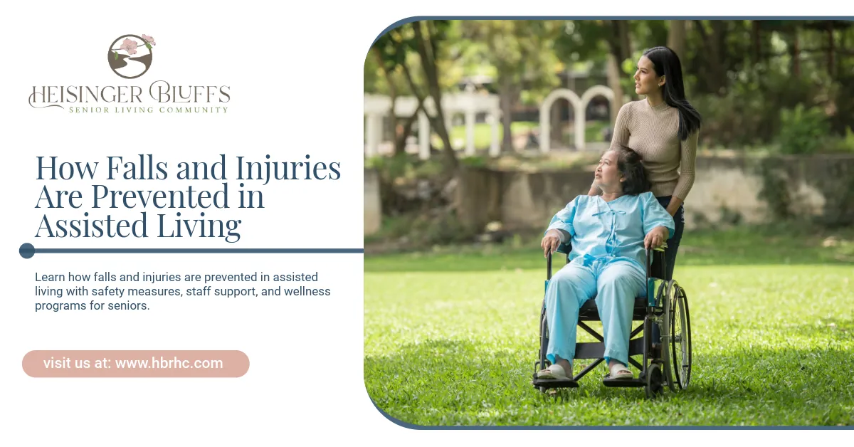 A woman pushes a wheelchair with an elderly person in a sunny park setting.