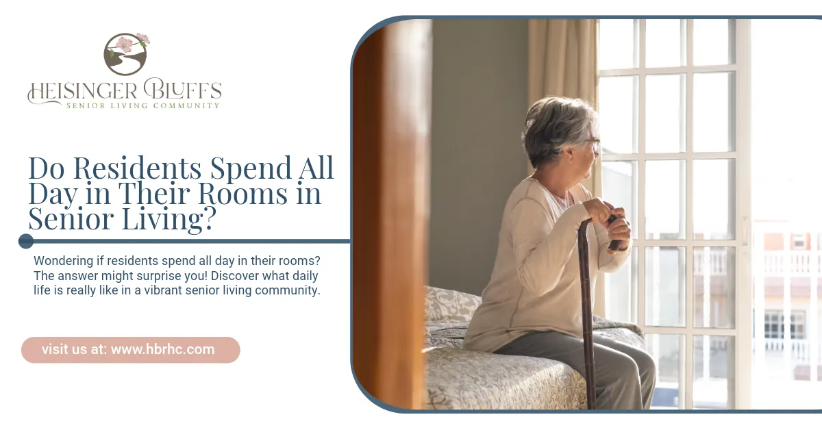 An elderly woman is sitting on a bed looking out a window.