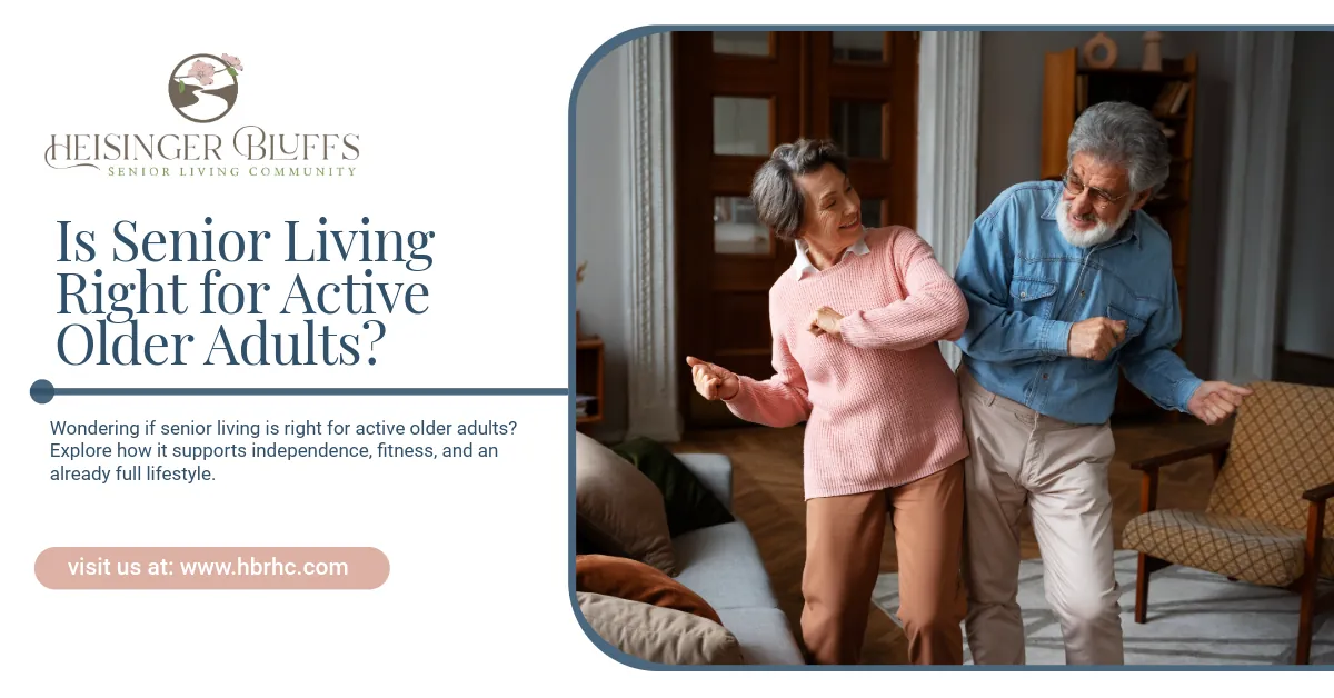 An elderly couple dancing together in a living room