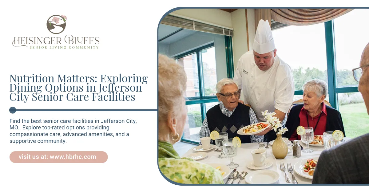 A chef is serving food to a group of people at a table.