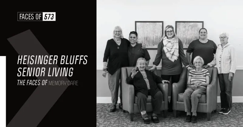 A black and white photo of a group of people posing for a photo