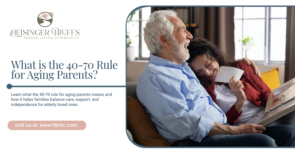 A woman is laughing with her elderly father on a couch