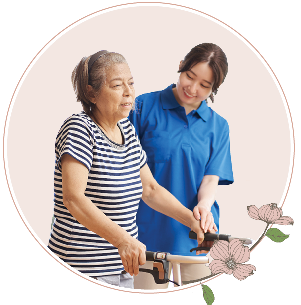 Senior woman walking with a caregiver at Heisinger Bluffs