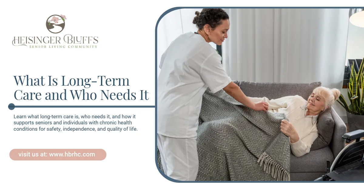Caregiver assisting an elderly person with a blanket on a couch.