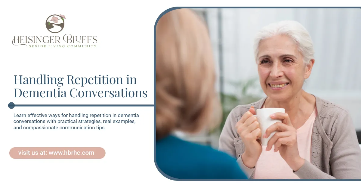 An elderly woman with dementia smiles while holding a mug in a conversation.