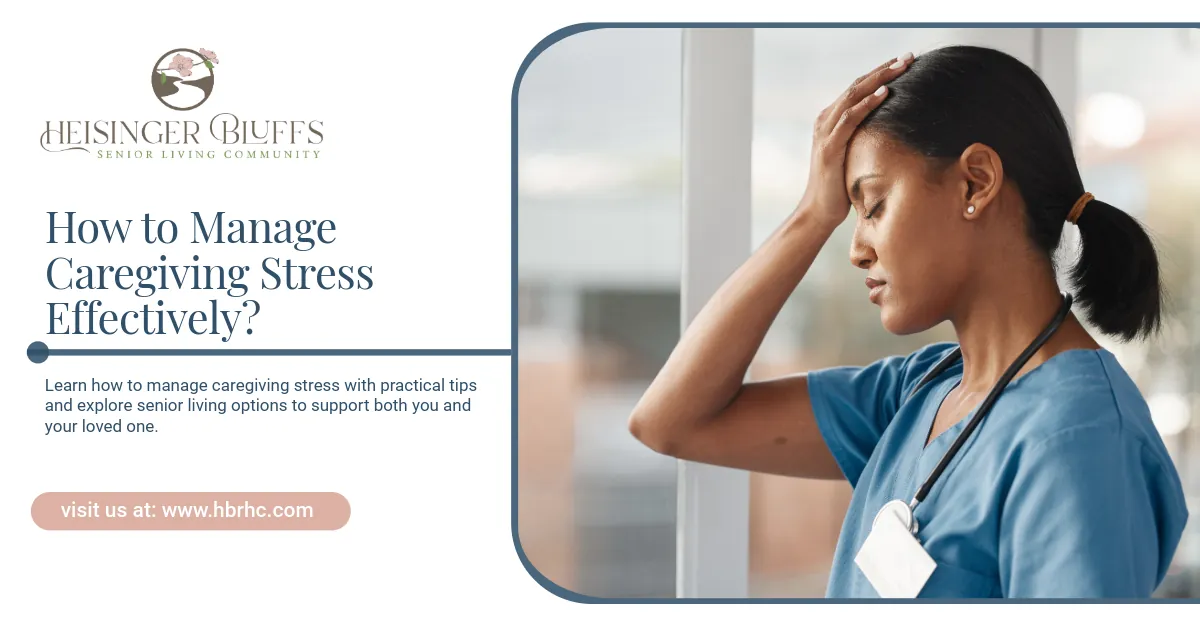 A caregiver  in blue scrubs stressed, hand on forehead, by the window.