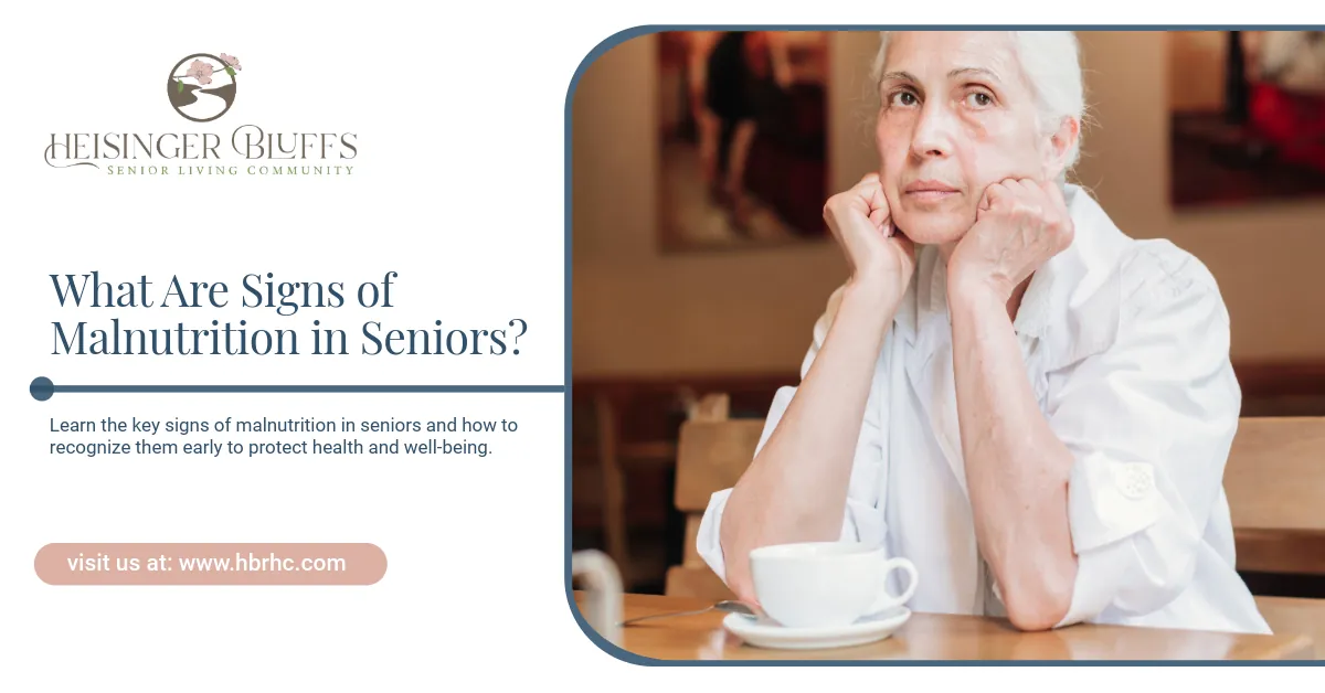 An elderly woman sitting at a table with a cup of coffee