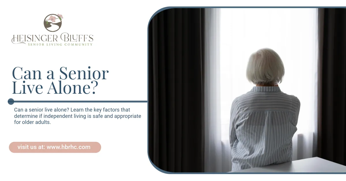 An older woman is sitting alone, looking out a window.