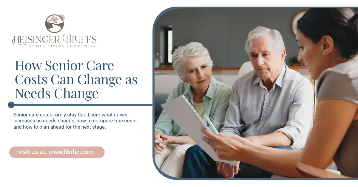 A senior caregiver talking to an elderly couple abour care plans