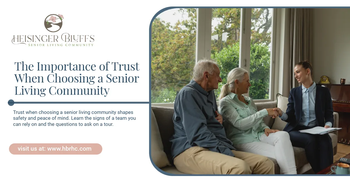 A senior couple talking to a senior living staff member