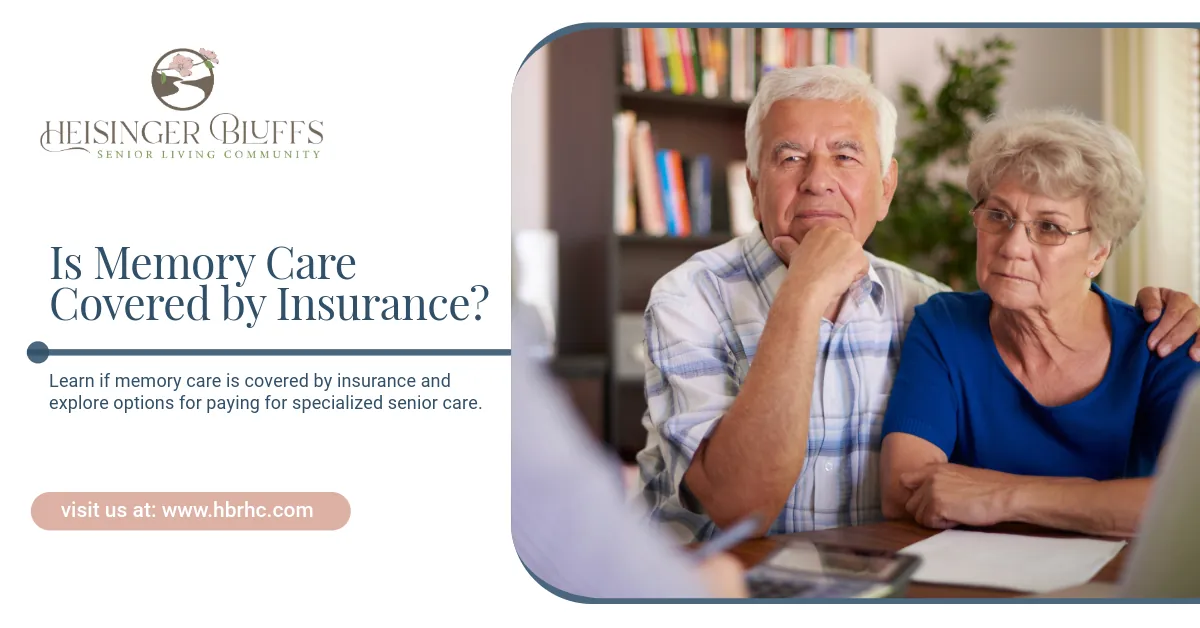 An elderly couple is listening while a staff member discusses insurance coverage for memory care