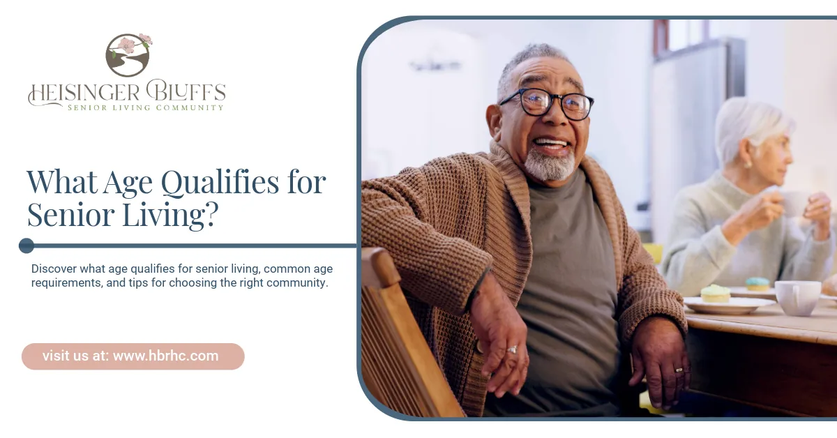 An elderly man sitting on a table, smiling