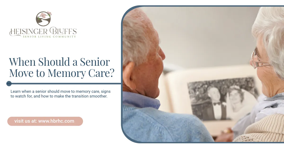 Two elderly couple looking at a photo album